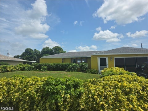 Photo of 1542 Canal Street, Lehigh Acres, FL 33936 (MLS # 2026031100)