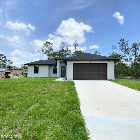 Photo of 3121 32nd Street SW, Lehigh Acres, FL 33976 (MLS # 2026039050)