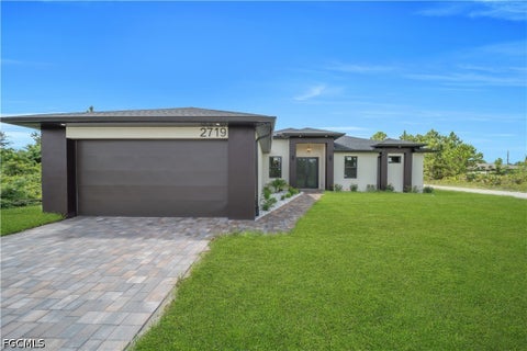 Photo of 2719 33RD Street W, Lehigh Acres, FL 33971 (MLS # 2026037487)