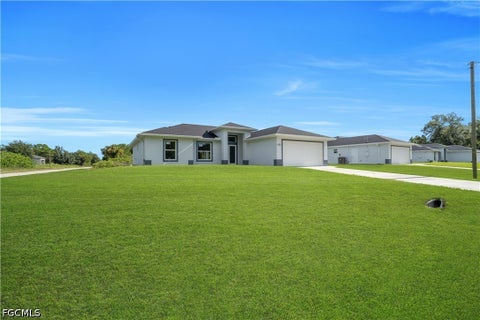 Photo of 1021 Pilgrim Street E, Lehigh Acres, FL 33974 (MLS # 2026039826)