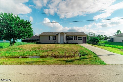 Photo of 3409 23rd Street W, Lehigh Acres, FL 33971 (MLS # 2026039869)