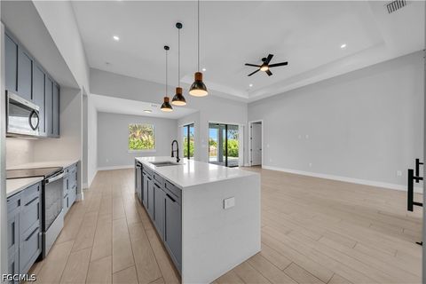 Tiny photo for 411 SW 26th Place, Cape Coral, FL 33991 (MLS # 2026022438)