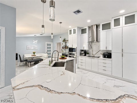 Tiny photo for 452 SW 19th Avenue, Cape Coral, FL 33991 (MLS # 2026037251)