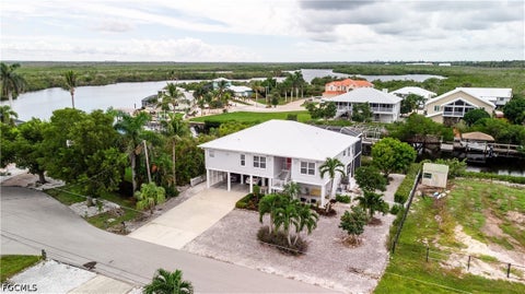 Photo of 5207 Ann Arbor Drive, Bokeelia, FL 33922 (MLS # 2026041402)
