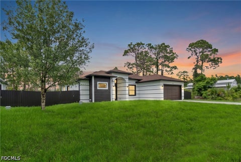 Photo of 1049 Merry Street E, Lehigh Acres, FL 33974 (MLS # 2026040182)