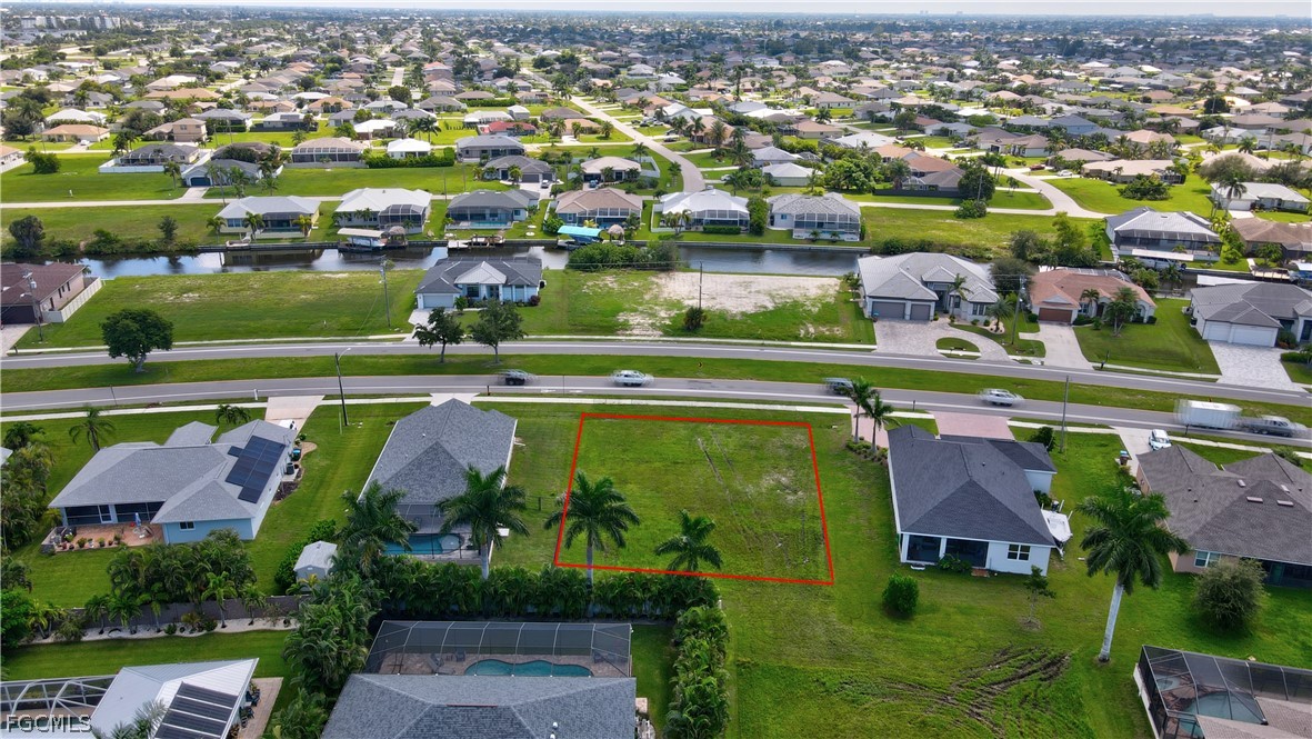 Aerial view of residential area featuring property
