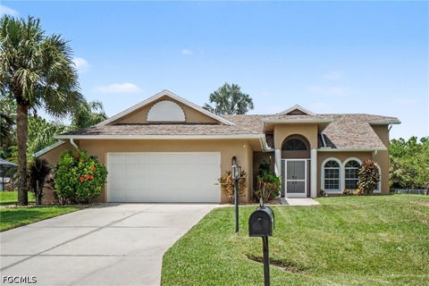 Photo of 405 Poinsettia Avenue, Lehigh Acres, FL 33972 (MLS # 2026037150)