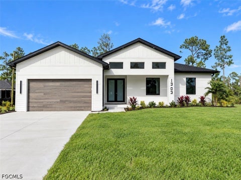 Photo of 1303 Broadway Avenue, Lehigh Acres, FL 33972 (MLS # 2026041897)