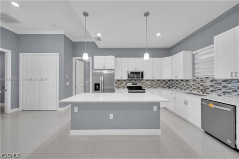 Photo of 105 E 15TH Street, Lehigh Acres, FL 33972 (MLS # 2026040972)