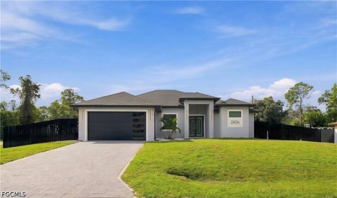 Photo of 2606 E 3rd Street, Lehigh Acres, FL 33936 (MLS # 2026042409)