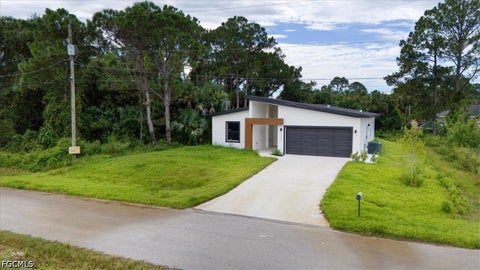 Photo of 1222 Hilliard Street E, Lehigh Acres, FL 33974 (MLS # 2026037823)