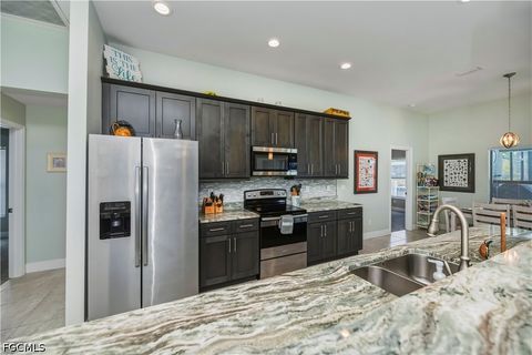 Tiny photo for 910 SW 12th Terrace, Cape Coral, FL 33991 (MLS # 2026015443)