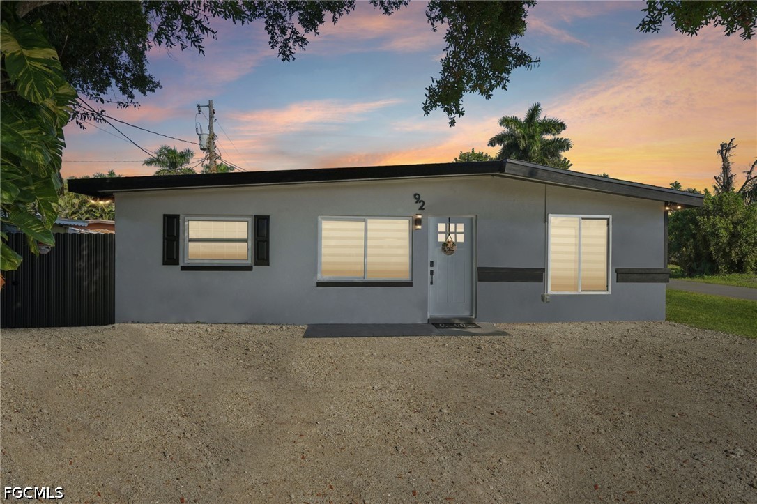 View of front of property featuring stucco siding