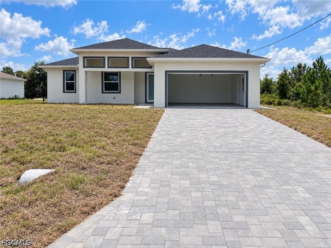 Photo of 1142 Ebert Street E, Lehigh Acres, FL 33974 (MLS # 2026039901)