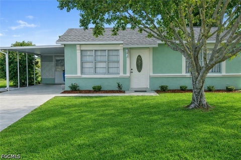Photo of 117 Stetson Street, Lehigh Acres, FL 33936 (MLS # 2026023652)