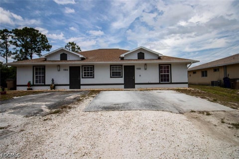 Photo of 1500/1502 W 12th Street, Lehigh Acres, FL 33972 (MLS # 2026037315)