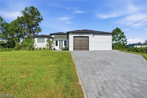 Photo of 1134 Holmes Avenue S, Lehigh Acres, FL 33974 (MLS # 2026038365)