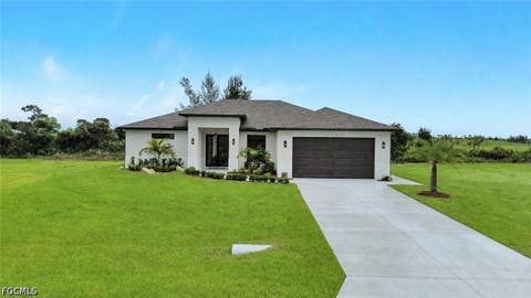 Photo of 1239 NW 24th Terrace, Cape Coral, FL 33993 (MLS # 2026035460)