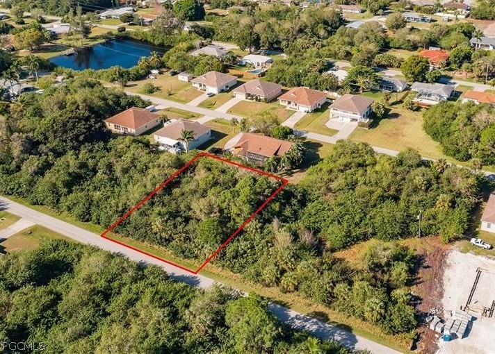 Aerial view of residential area with property boun