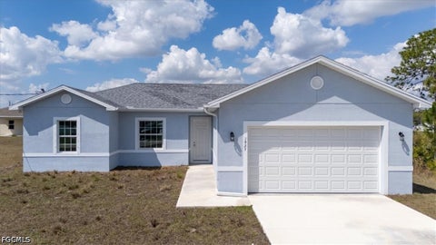 Photo of 1927 Richmond Avenue N, Lehigh Acres, FL 33972 (MLS # 2026040122)