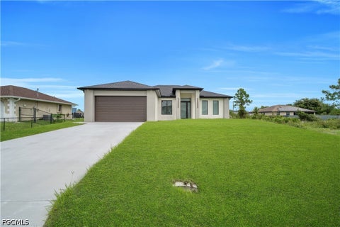 Photo of 3308 10th Street SW, Lehigh Acres, FL 33976 (MLS # 2026040901)