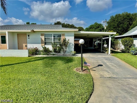 Photo of 48 Heath Aster Lane, Lehigh Acres, FL 33936 (MLS # 2026037804)