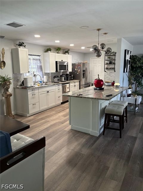 Photo of 2702 SE 17th Place, Cape Coral, FL 33904 (MLS # 2026019915)