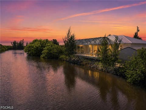 Photo of 3400 Coquina Lane, St James City, FL 33956 (MLS # 2026034789)
