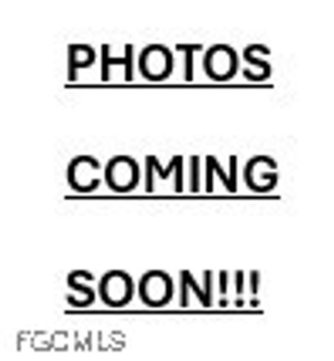 Photo of 312 Hollywood St St, Lehigh Acres, FL 33936 (MLS # 2026004113)