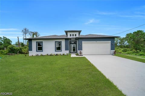 Photo of 543 McArthur Boulevard, Lehigh Acres, FL 33974 (MLS # 2026033747)