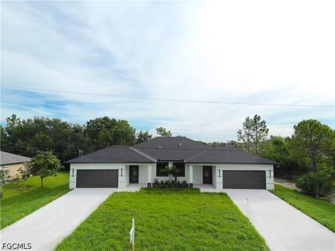 Photo of 2404 Dickens Avenue N, Lehigh Acres, FL 33971 (MLS # 2026015237)
