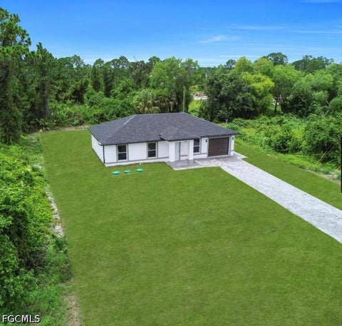 Photo of 382 McArthur Boulevard, Lehigh Acres, FL 33974 (MLS # 2026043033)