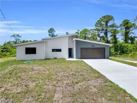Photo of 1006 Macy Street E, Lehigh Acres, FL 33974 (MLS # 2026043237)