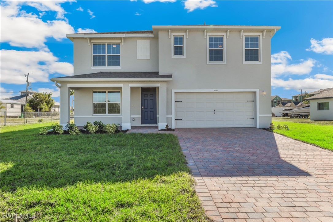 MODEL - View of front of house with stucco siding,