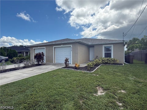 Photo of 606 SE 13th Terrace, Cape Coral, FL 33990 (MLS # 2026039245)