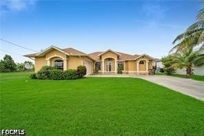 Photo of 621 NW 37th Avenue, Cape Coral, FL 33993 (MLS # 2026039379)