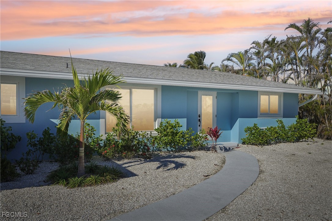 View of front of property with stucco siding and a