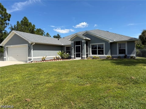 Photo of 702 Calvin Avenue, Lehigh Acres, FL 33972 (MLS # 2026040794)