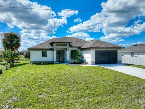 Photo of 1019 Cedartree Avenue, Lehigh Acres, FL 33971 (MLS # 2026026754)