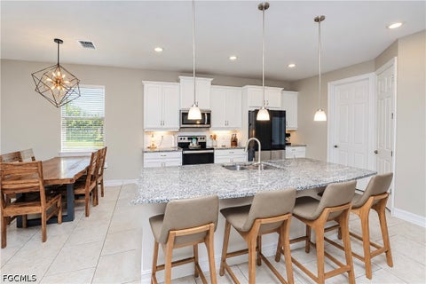 Tiny photo for 113 SW 33rd Place, Cape Coral, FL 33991 (MLS # 2026037127)
