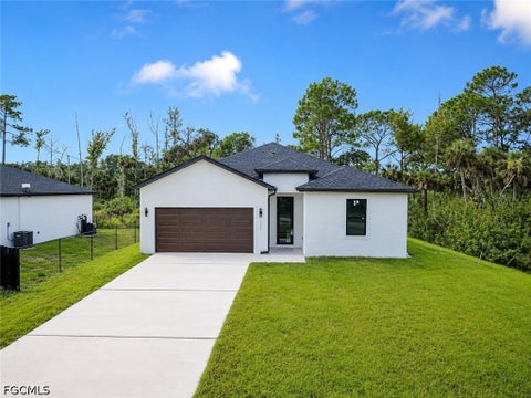 Photo of 621 GREENBRIAR Boulevard, Lehigh Acres, FL 33972 (MLS # 2026037448)