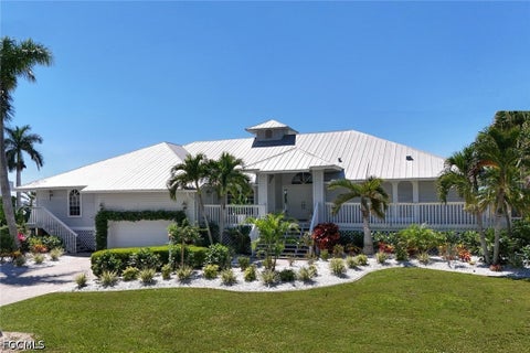 Photo of 656 Coral Drive, Cape Coral, FL 33904 (MLS # 2026027457)