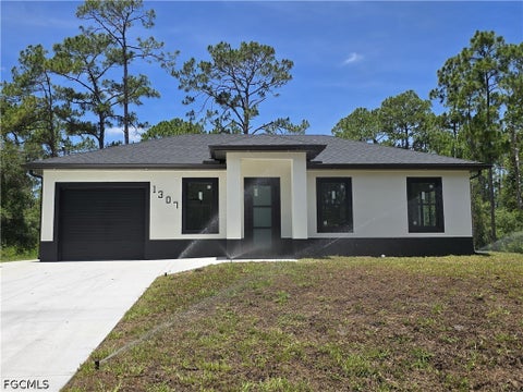 Photo of 1307 Monroe Avenue, Lehigh Acres, FL 33972 (MLS # 2026026913)