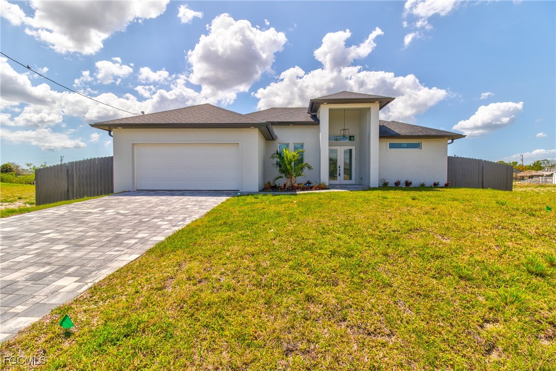 Prairie-style home with stucco siding, decorative