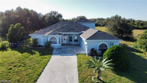 Photo of 1709 Moore Avenue, Lehigh Acres, FL 33972 (MLS # 2026039137)