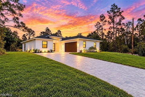 Photo of 719 Almelia Street E, Lehigh Acres, FL 33974 (MLS # 2026042859)