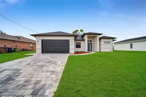 Photo of 740 Chestnut Street E, Lehigh Acres, FL 33974 (MLS # 2026038315)