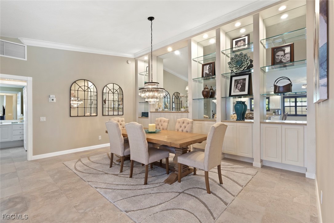 Elegantly designed dining room with lighted shelvi