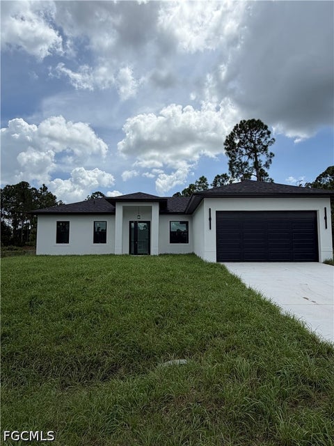 Photo of 1052 Grove Street E, Lehigh Acres, FL 33974 (MLS # 2026038964)