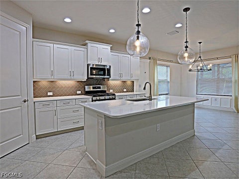 Photo of 7652 Cypress Walk Drive, Fort Myers, FL 33966 (MLS # 2026039486)